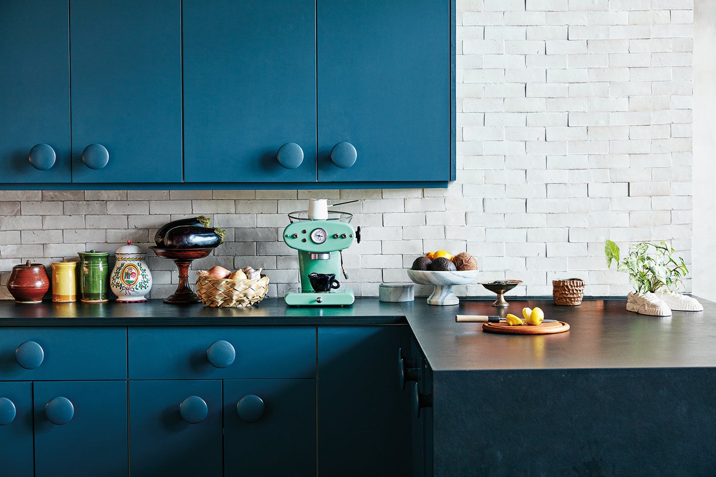 navy blue cabinets with round knobs